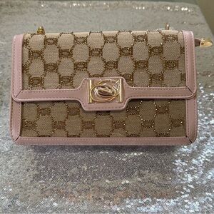 bebe Tan and Gold Wristlet with Pink Trim with chain straps